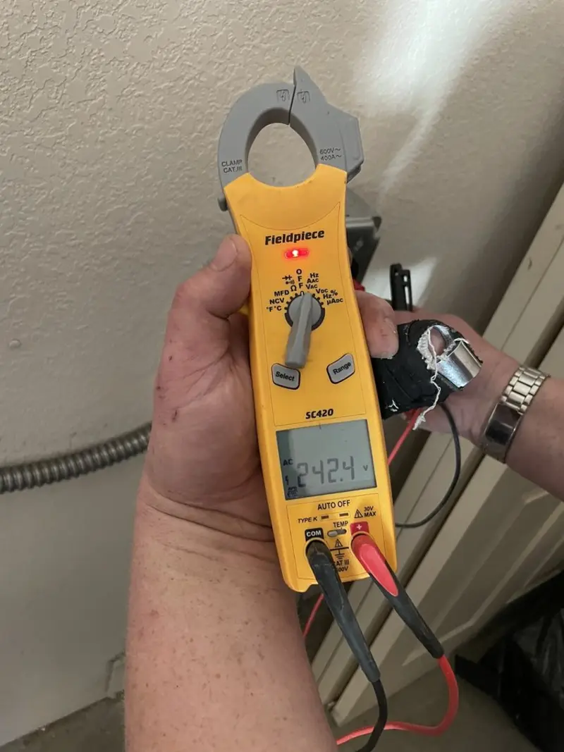 Voltage testing with clamp meter during Generator Installation in Welby
